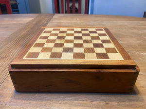 Wooden magnetic board placed on wooden table.