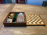 Chess lid comes off with storage for game pieces inside box.