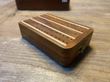 Miniature cribbage board.